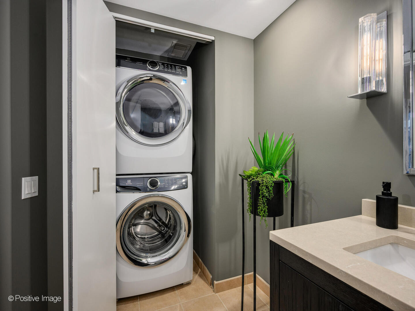 60 East Monroe Street, Unit 2001 Chicago, IL 60603 - Photo 20 of 68 a view of a hallway with washer and dryer