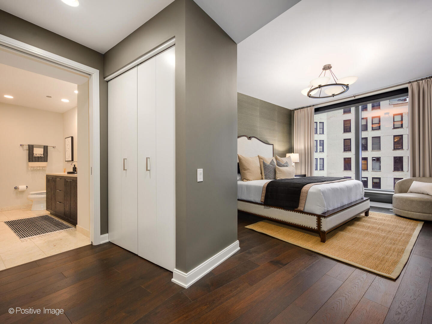 60 East Monroe Street, Unit 2001 Chicago, IL 60603 - Photo 22 of 68 a bedroom with a large bed and a rug