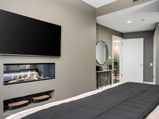 a bathroom with a double vanity sink toilet and a mirror