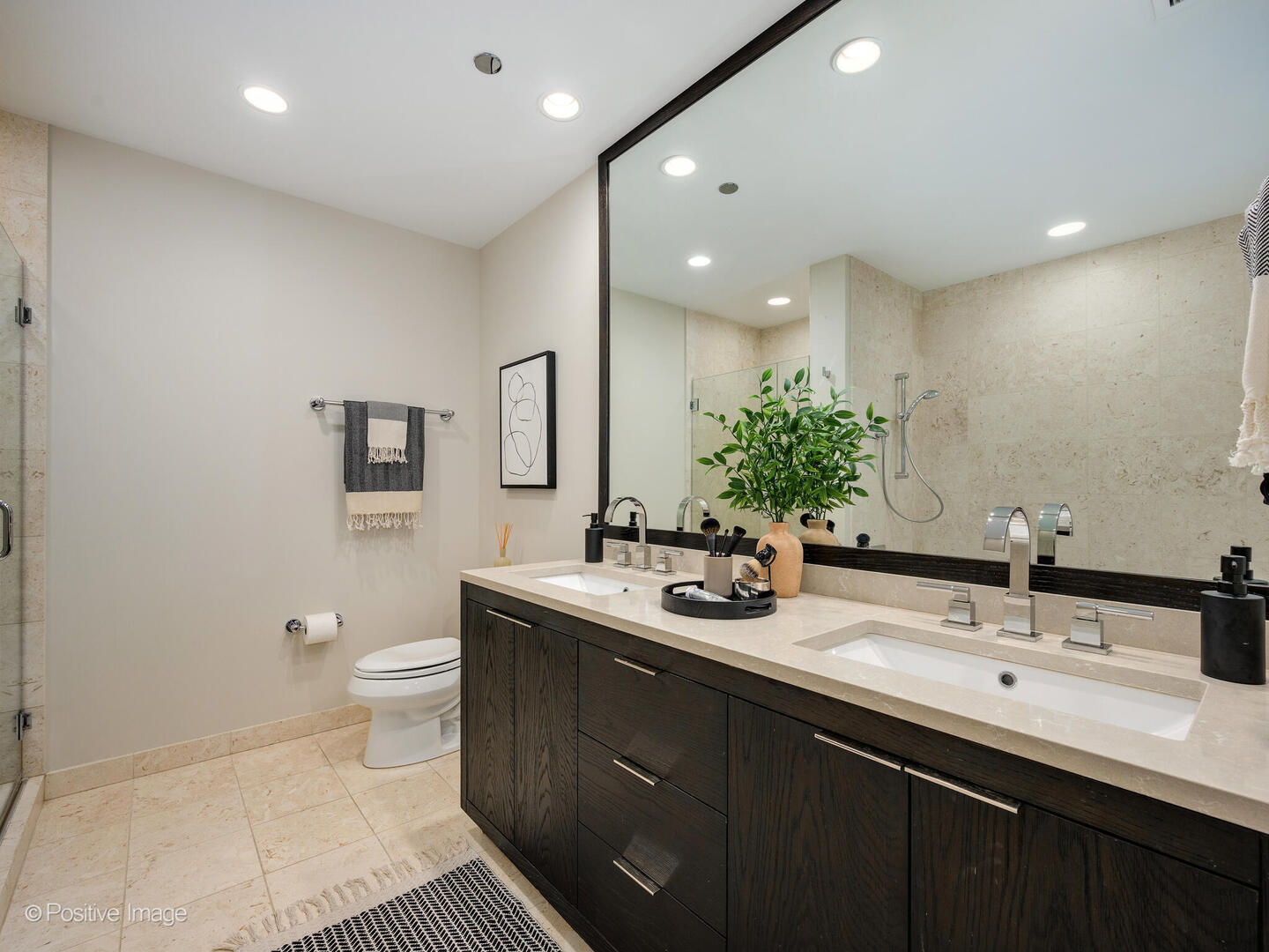 60 East Monroe Street, Unit 2001 Chicago, IL 60603 - Photo 25 of 68 a bathroom with a double vanity sink toilet and a mirror