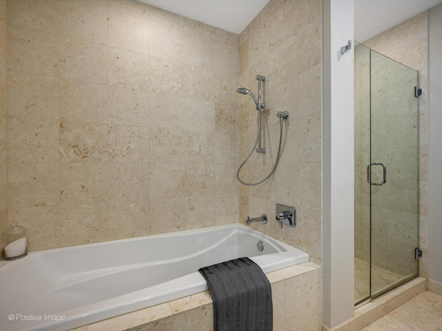 60 East Monroe Street, Unit 2001 Chicago, IL 60603 - Photo 26 of 68 a bathroom with a sink and a shower