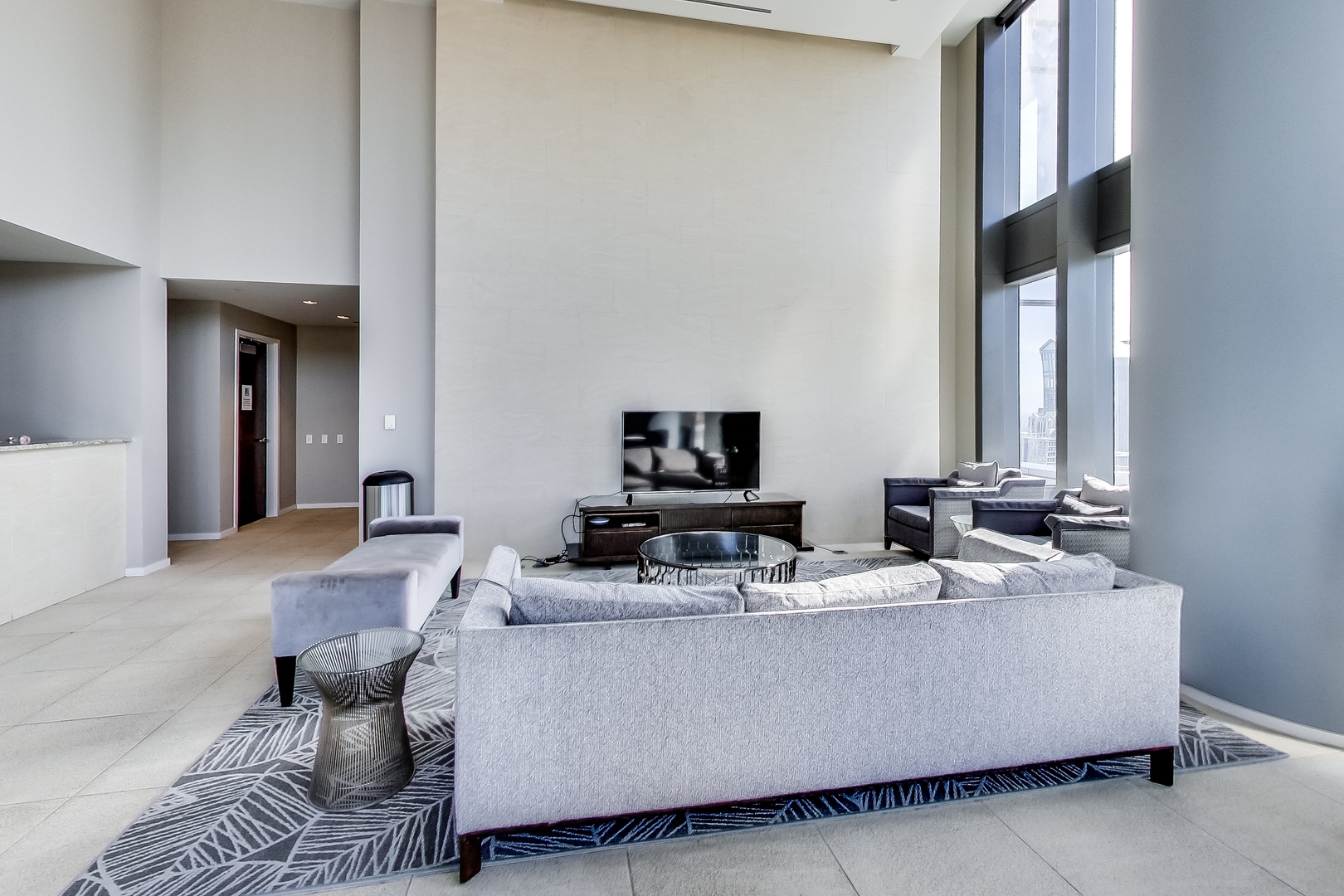60 East Monroe Street, Unit 2001 Chicago, IL 60603 - Photo 34 of 68 a living room with furniture and a flat screen tv