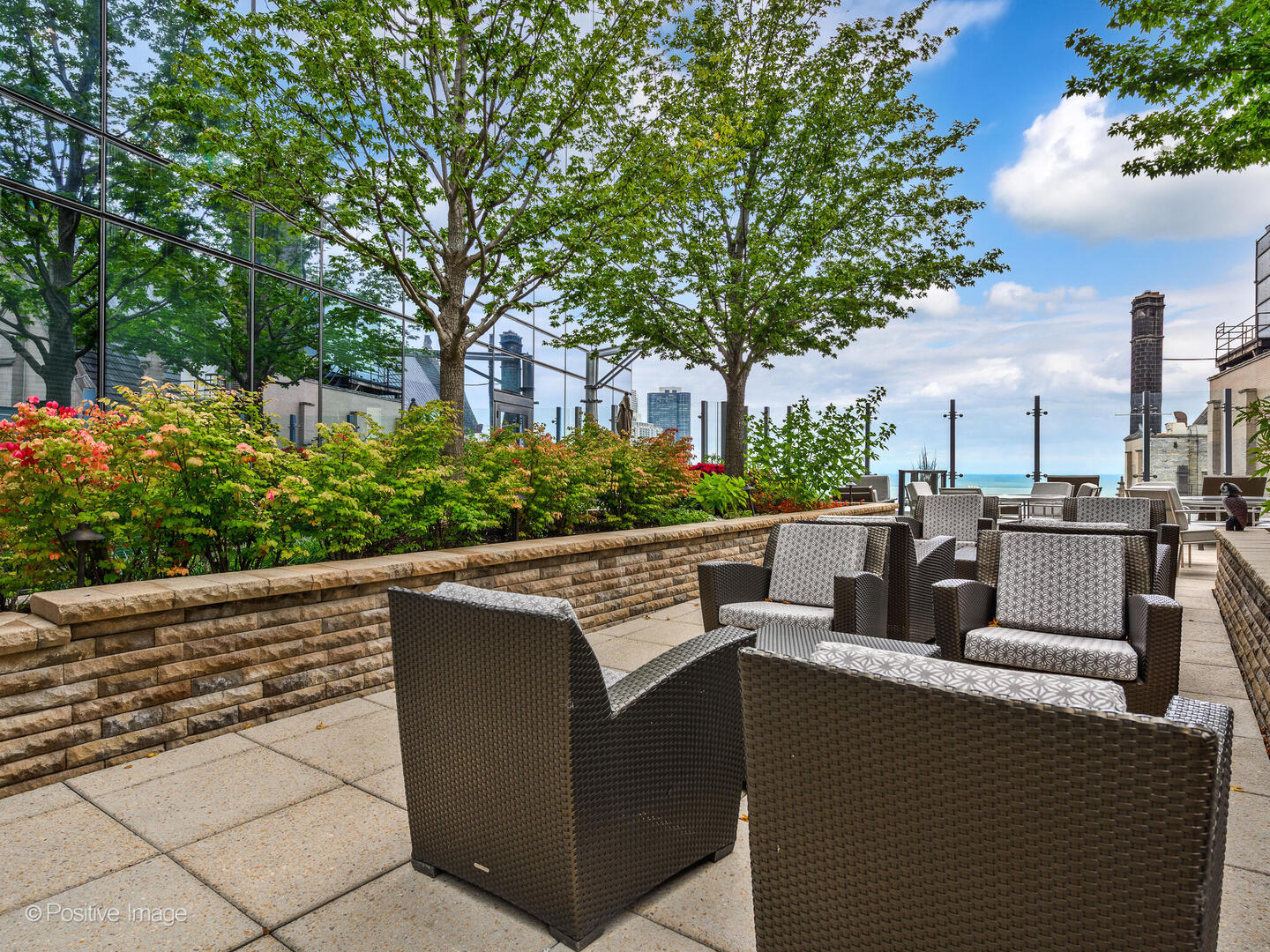 60 East Monroe Street, Unit 2001 Chicago, IL 60603 - Photo 51 of 68 a view of a patio with couches and a fire pit
