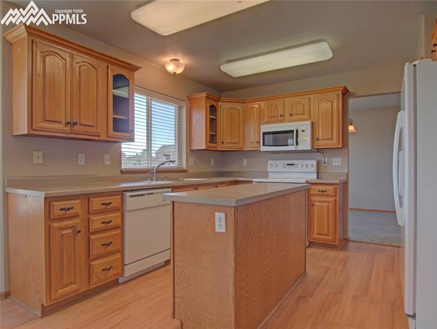 8380 Tannenbaum Road Colorado Springs, CO 80908 - Photo 9 of 22 View of kitchen