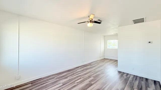 a view of room with hardwood floor