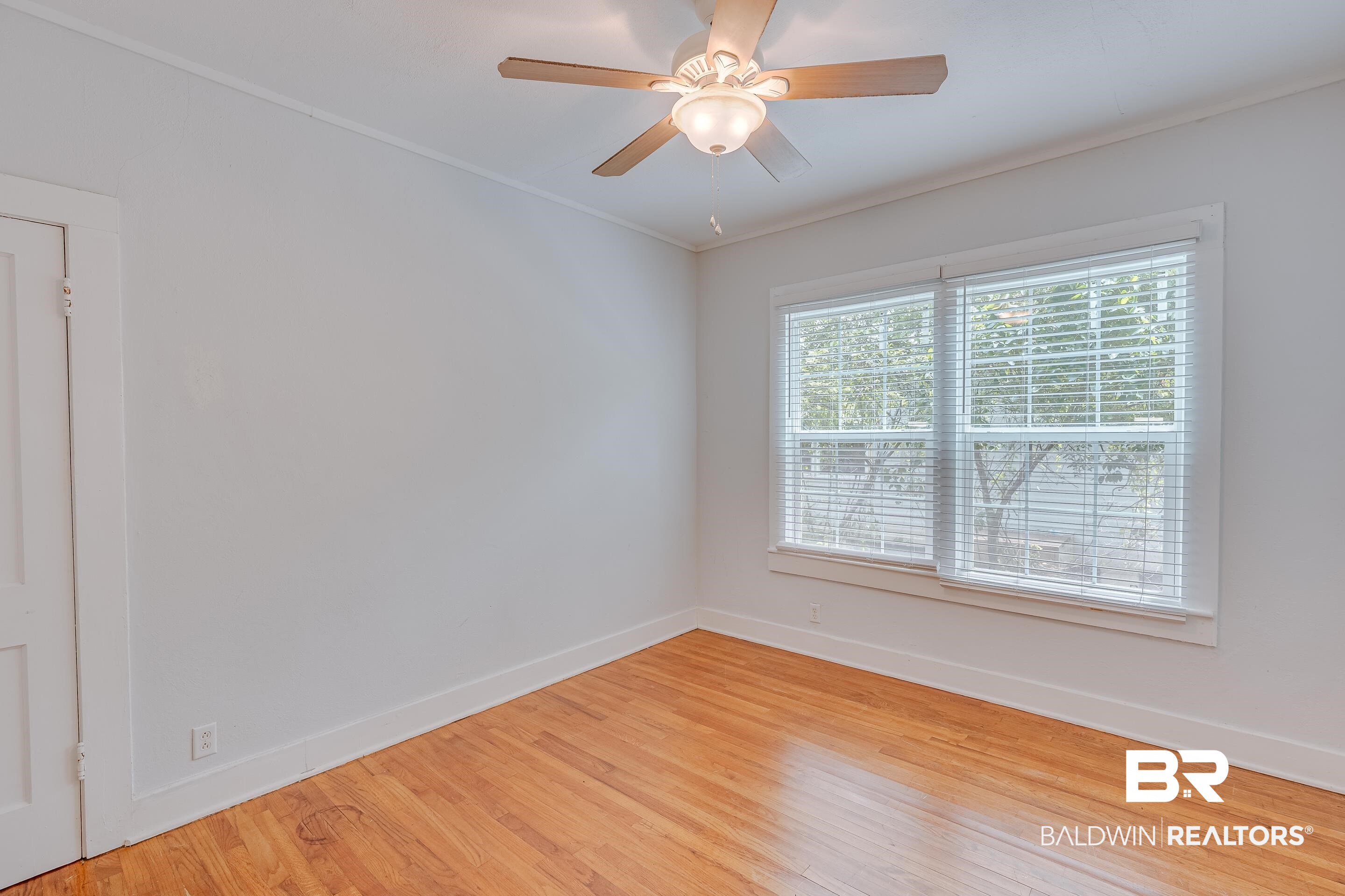 1852 Old Shell Road Mobile, AL 36607 - Photo 13 of 26 Empty room featuring light wood-type flooring and a ceiling fan