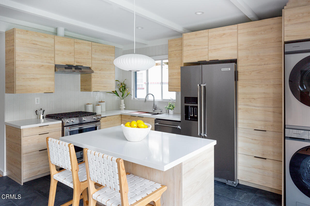 1649 New York Drive Altadena, CA 91001 - Photo 14 of 29 a kitchen with a refrigerator a stove and a wooden floor