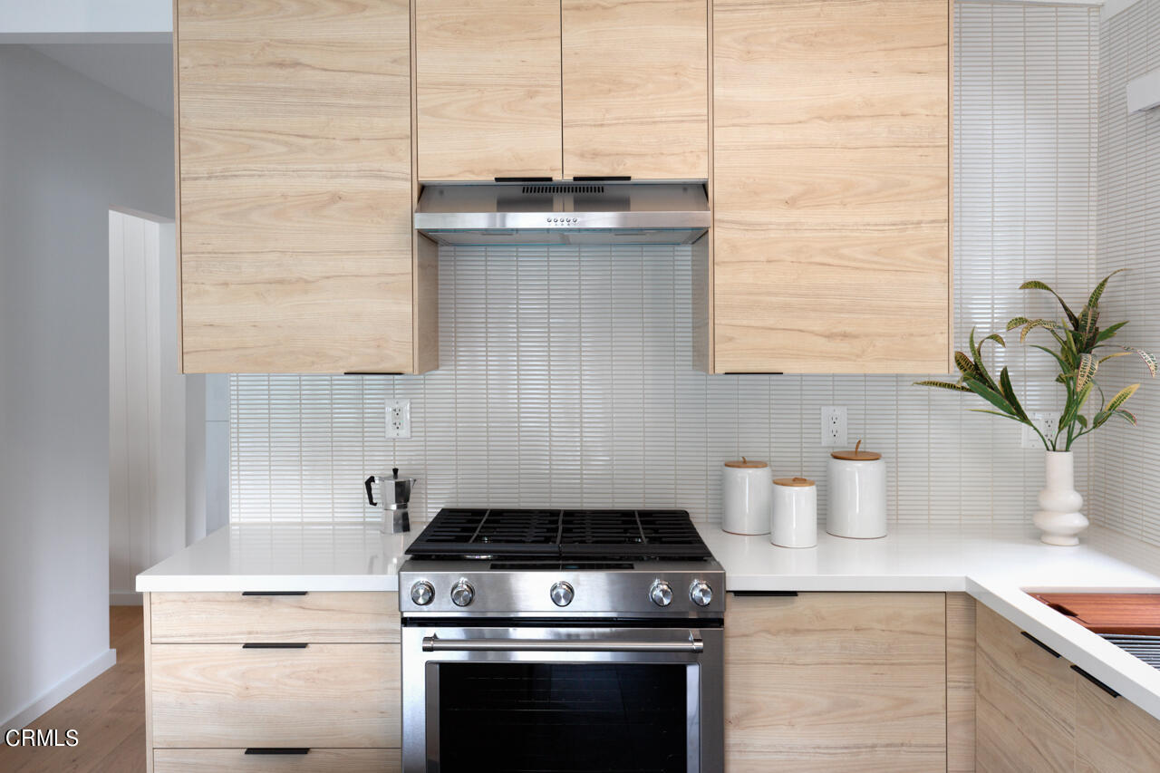 1649 New York Drive Altadena, CA 91001 - Photo 15 of 29 a kitchen with a stove and a potted plant
