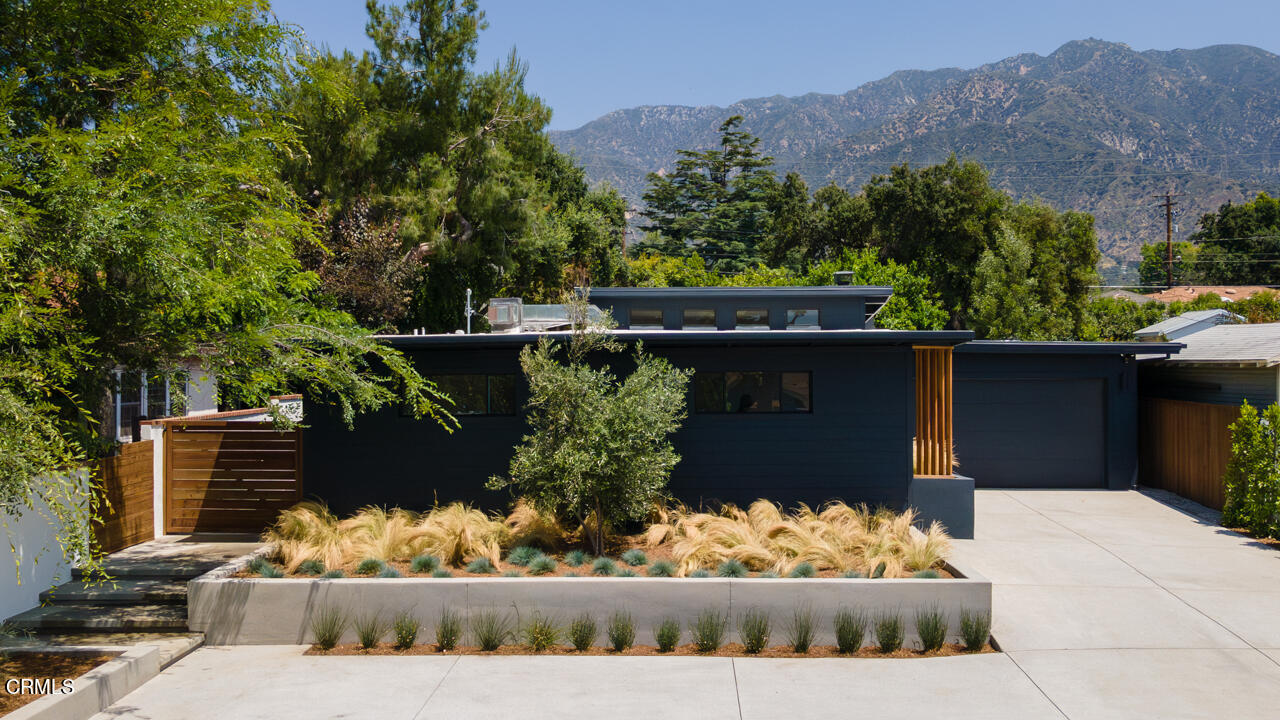 1649 New York Drive Altadena, CA 91001 - Photo 3 of 29 a view of a wooden fence with flower garden