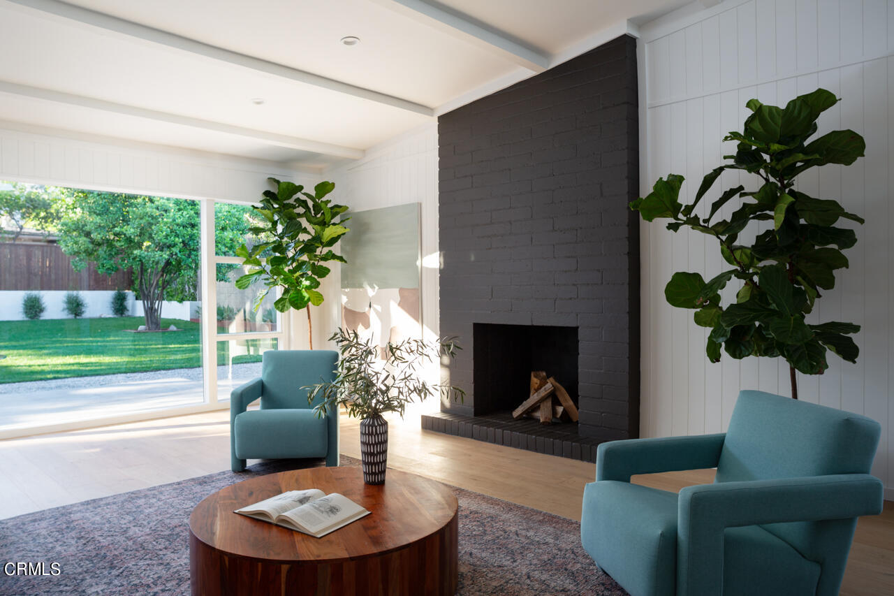 1649 New York Drive Altadena, CA 91001 - Photo 8 of 29 a living room with furniture a fireplace and a potted plant