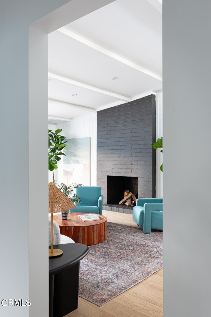 1649 New York Drive Altadena, CA 91001 - Photo 10 of 29 a living room with furniture and a fireplace