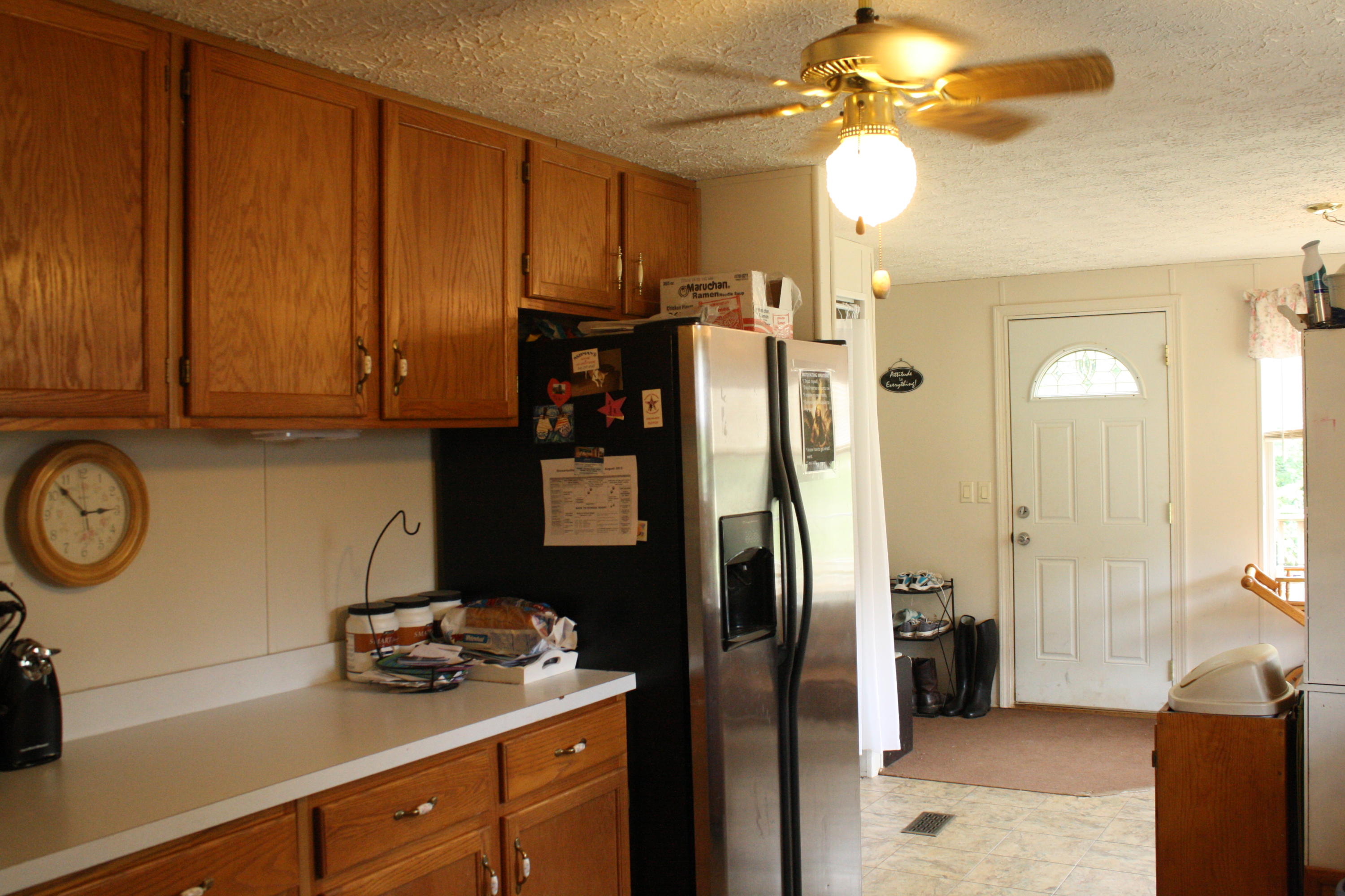 1048 Veteran Road Vinton, VA 24179 - Photo 8 of 13 a kitchen with stainless steel appliances granite countertop a refrigerator a stove and a sink