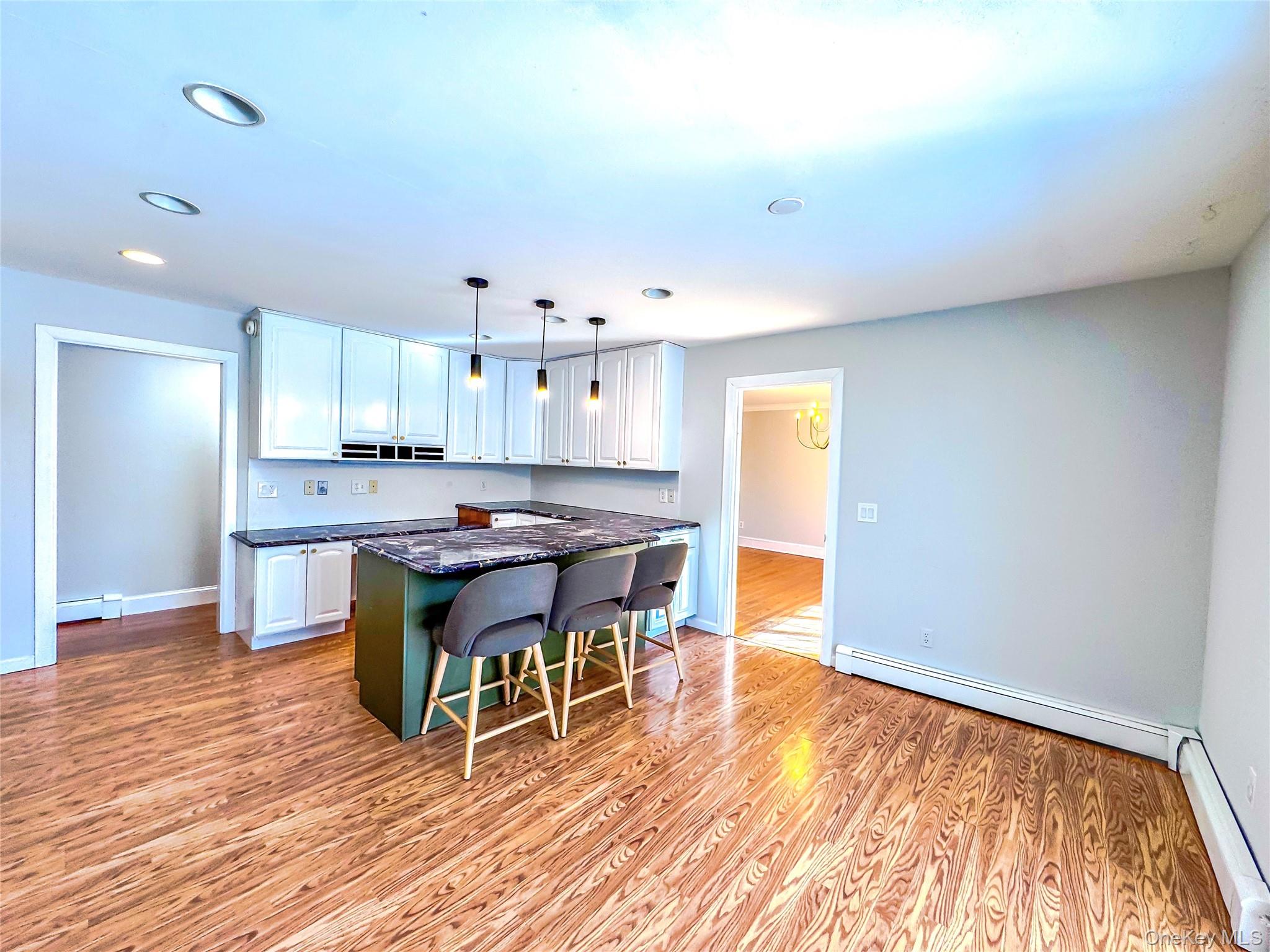 250 Maloney Road Wappingers Falls, NY 12590 - Photo 11 of 24 a open kitchen with a table and chairs in it