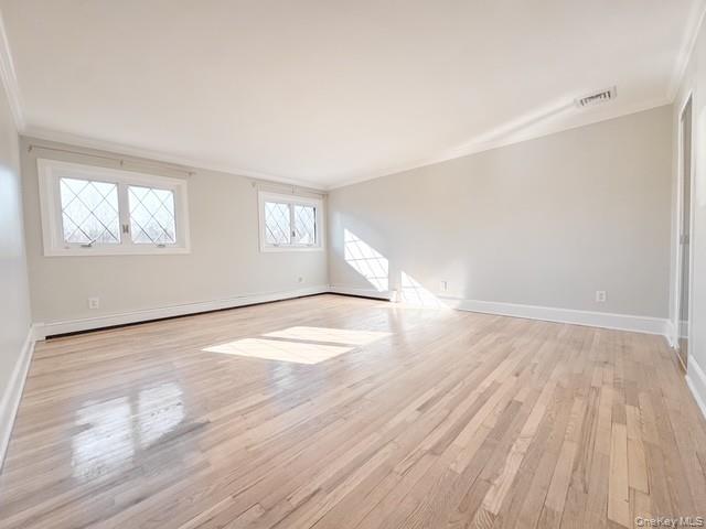 250 Maloney Road Wappingers Falls, NY 12590 - Photo 13 of 24 an empty room with wooden floor and windows