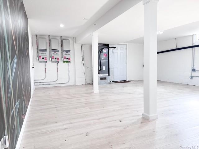 250 Maloney Road Wappingers Falls, NY 12590 - Photo 16 of 24 an empty room with wooden floor and entryway