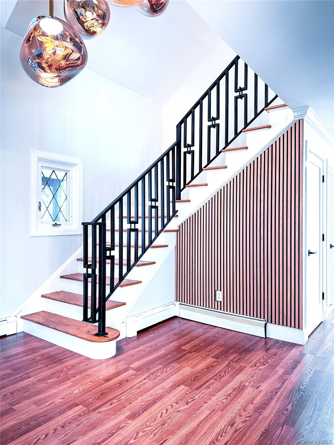 250 Maloney Road Wappingers Falls, NY 12590 - Photo 3 of 24 a view of staircase with wooden floor and a window