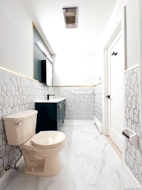 250 Maloney Road Wappingers Falls, NY 12590 - Photo 8 of 24 a bathroom with a toilet a sink and a bathtub