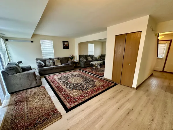 a living room with furniture and a rug