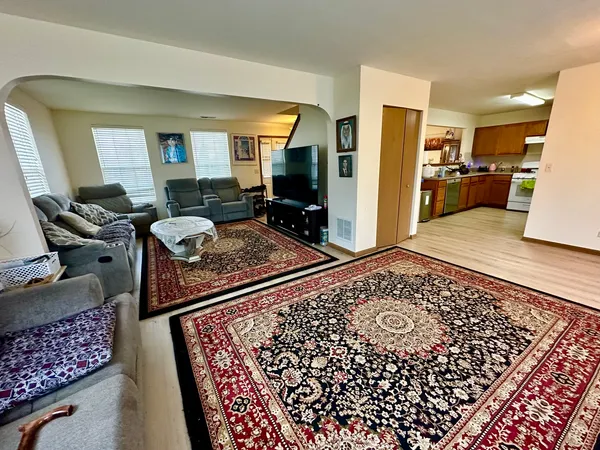 a kitchen with a stove sink and a refrigerator