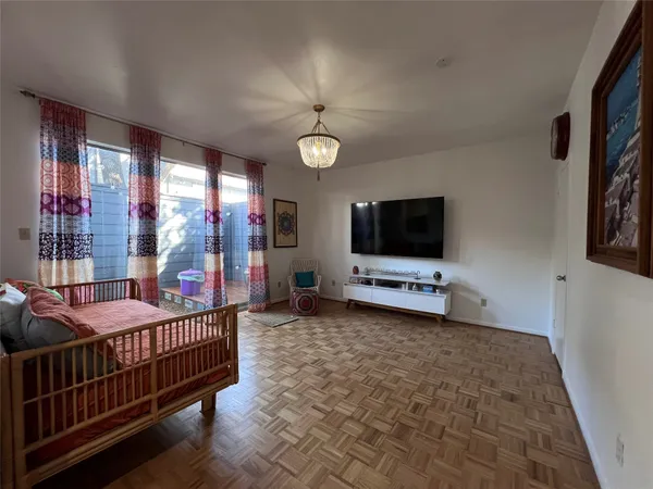 a room with furniture and a flat screen tv