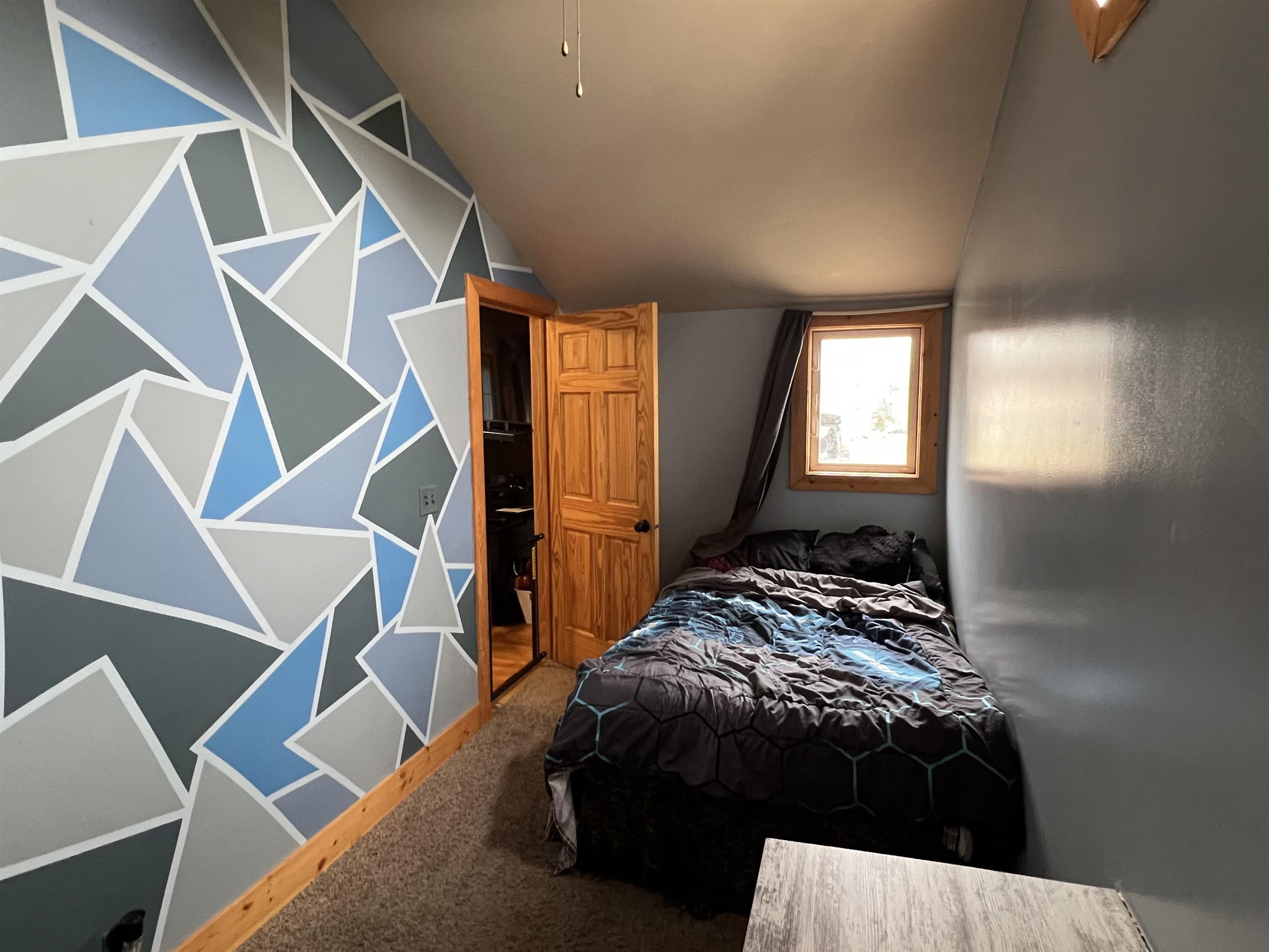 616 Cranston Road Beloit, WI 53511 - Photo 16 of 21 a bedroom with a bed and a window
