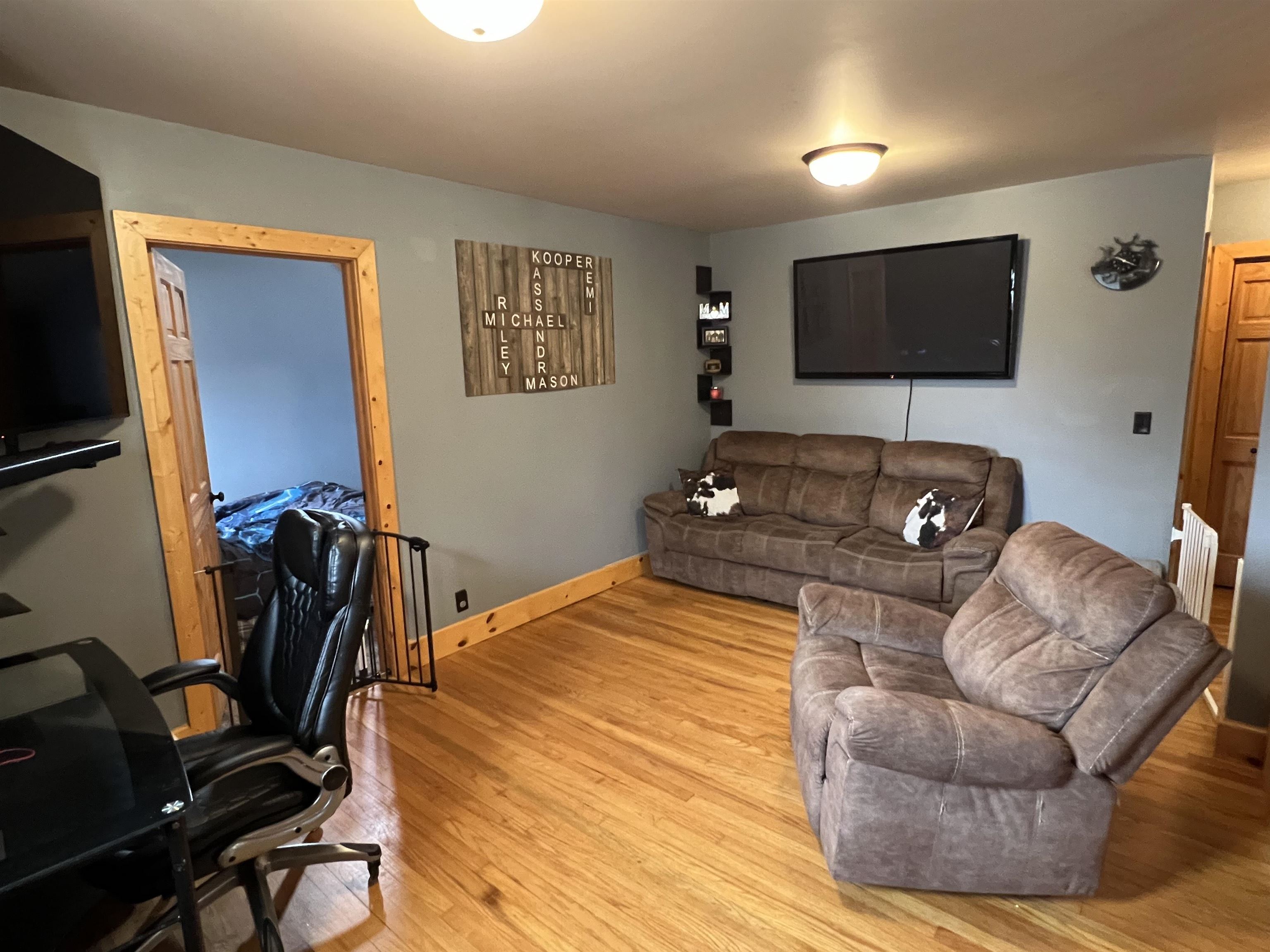616 Cranston Road Beloit, WI 53511 - Photo 5 of 21 a living room with furniture and a flat screen tv
