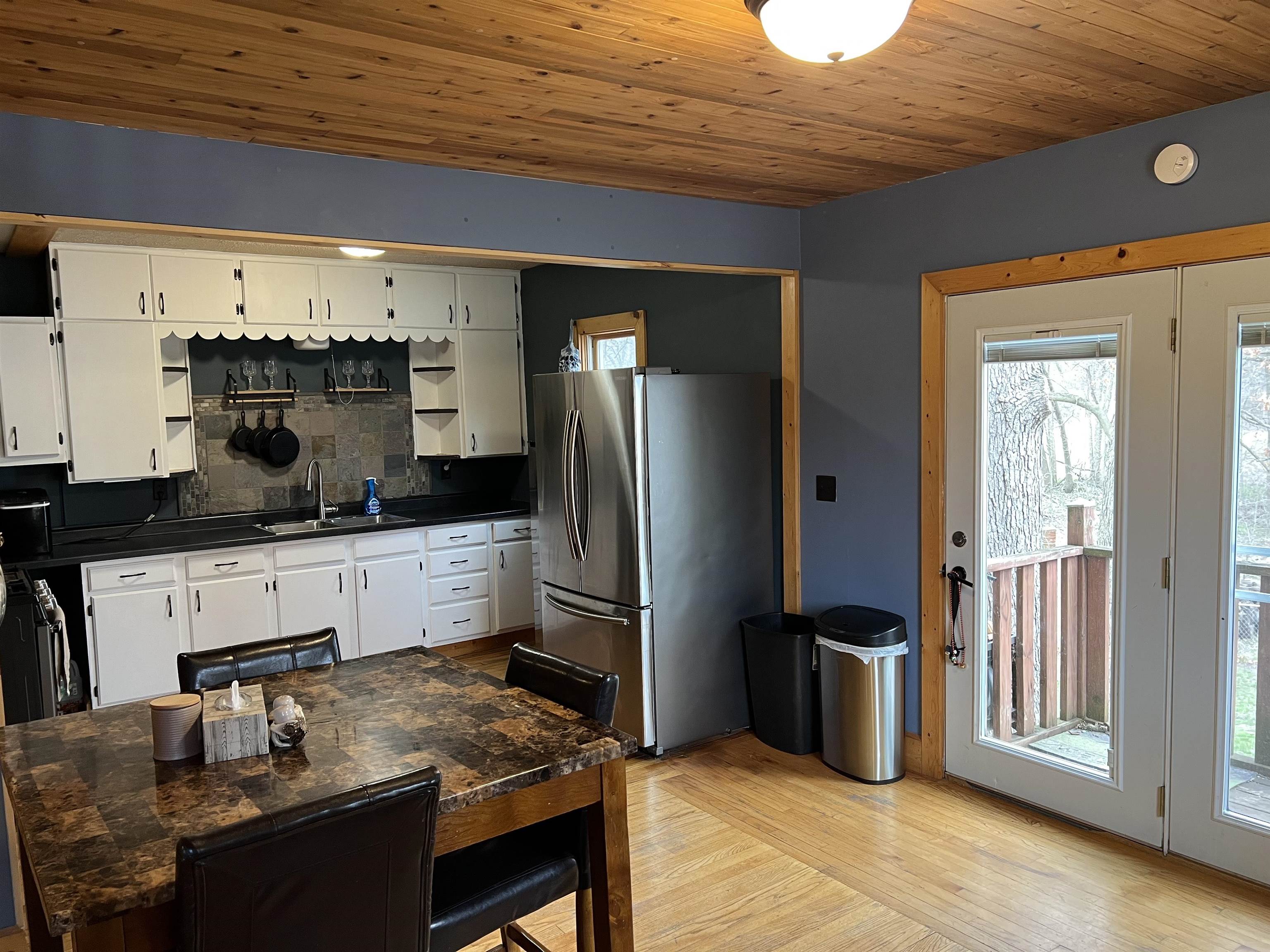 616 Cranston Road Beloit, WI 53511 - Photo 7 of 21 a kitchen with stainless steel appliances granite countertop a refrigerator and a stove