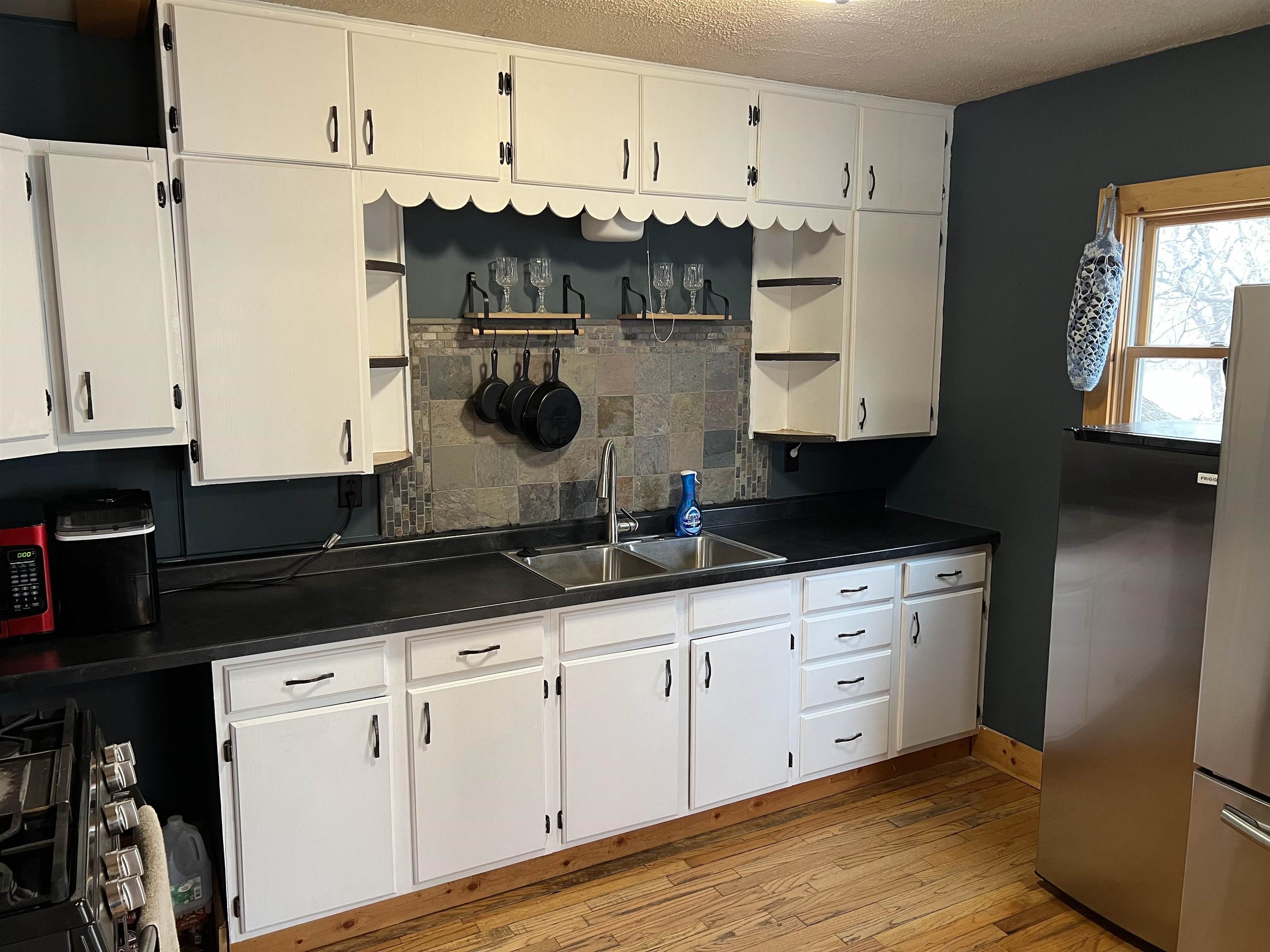 616 Cranston Road Beloit, WI 53511 - Photo 9 of 21 a kitchen with stainless steel appliances a sink stove and refrigerator