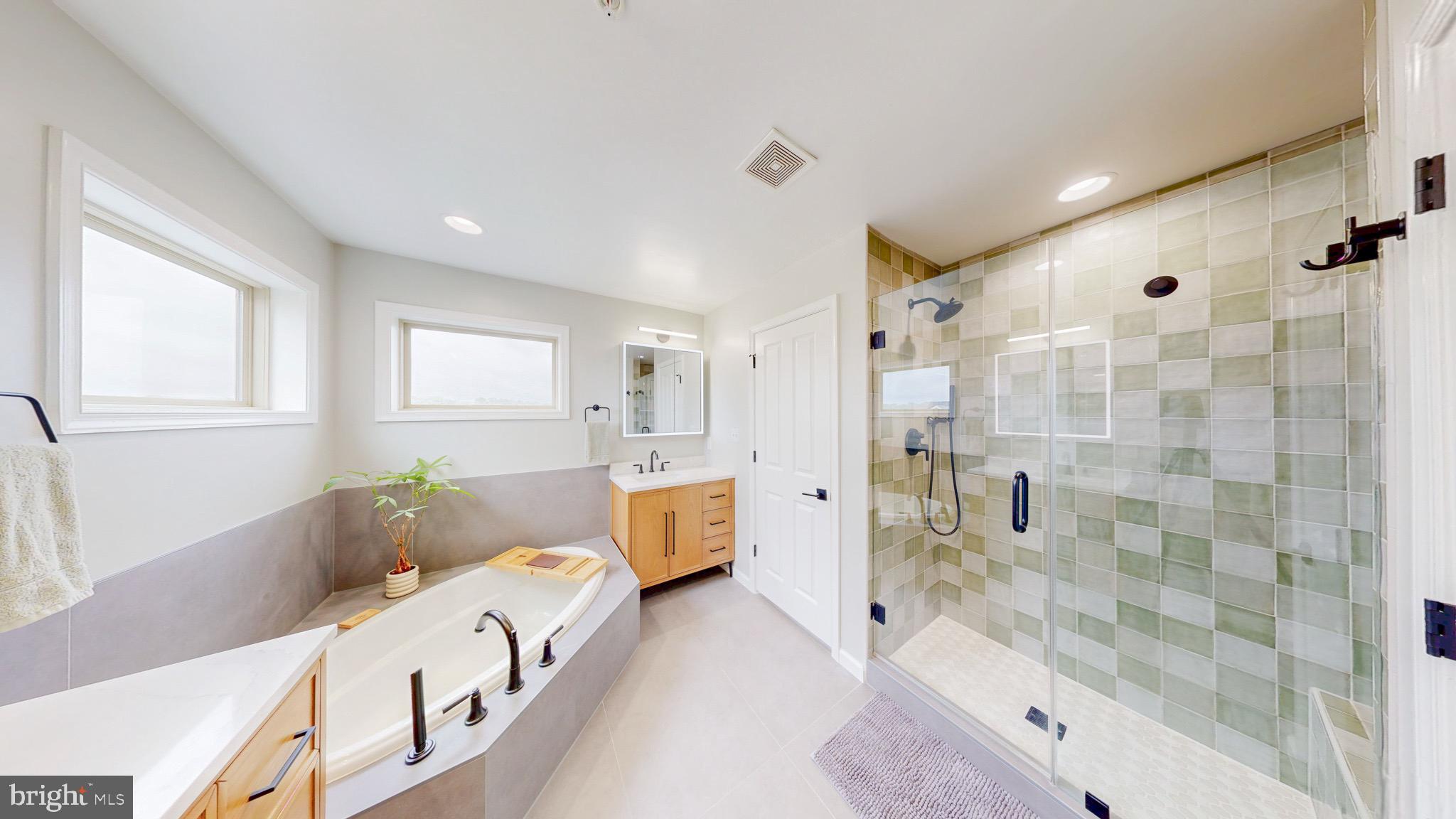 13227 Deer Highlands Way Silver Spring, MD 20906 - Photo 14 of 20 a bathroom with a tub sink and shower