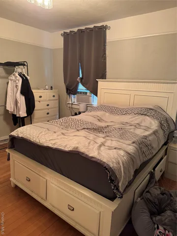 a bedroom with a bed and a cabinets