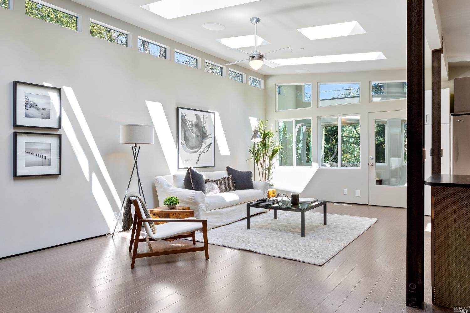 20 Idalia Road San Anselmo, CA 94960 - Photo 1 of 1 a living room with furniture wooden floor and a chandelier