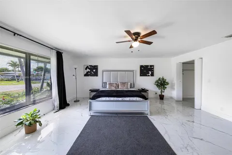 a view of living room with furniture and a potted plant
