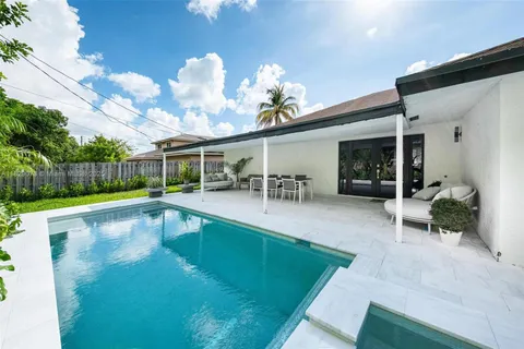 a view of a house with a swimming pool