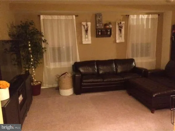 a living room with furniture and a gate
