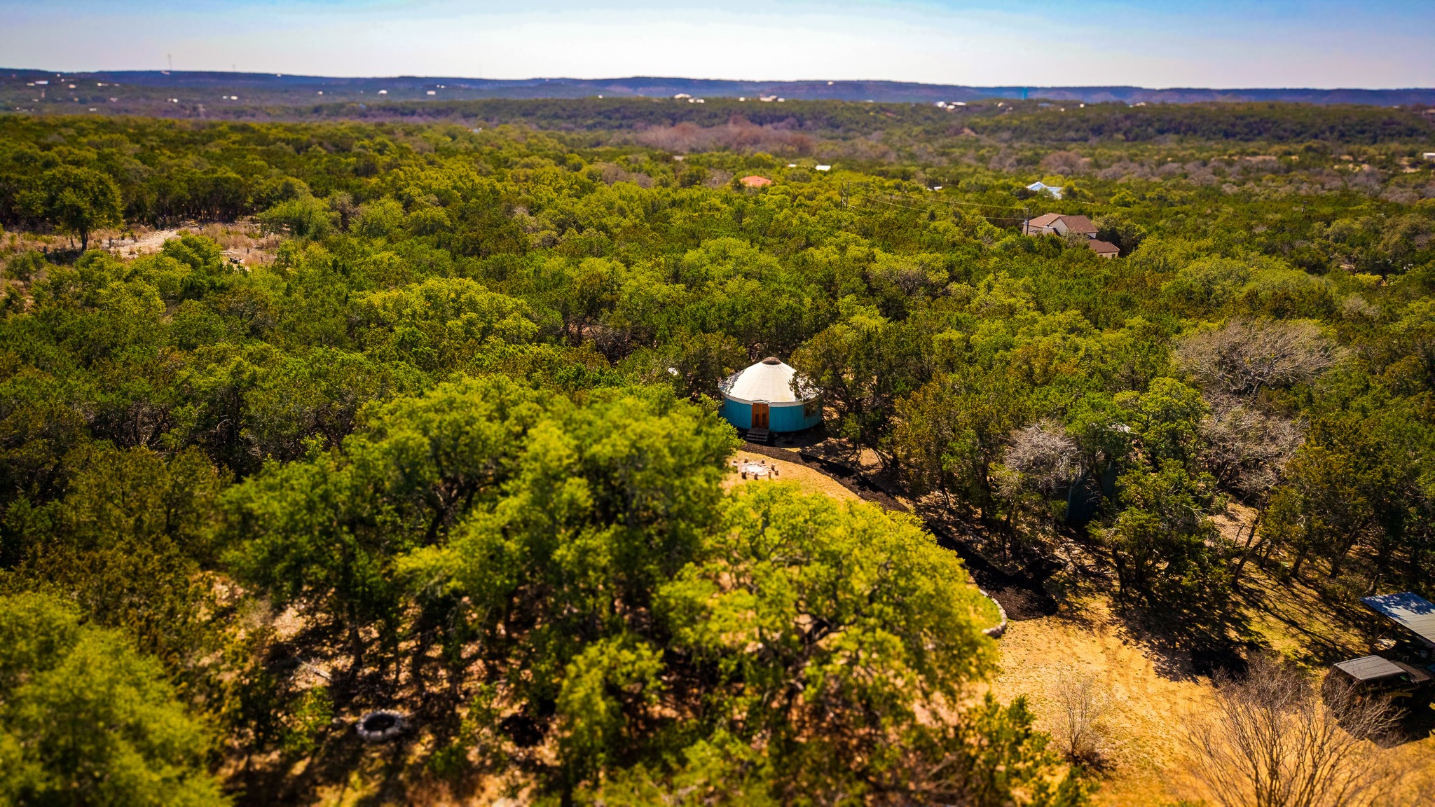 321 Lea Lane Wimberley, TX 78676 - Photo 30 of 39 Drone / aerial view of a heavily wooded area
