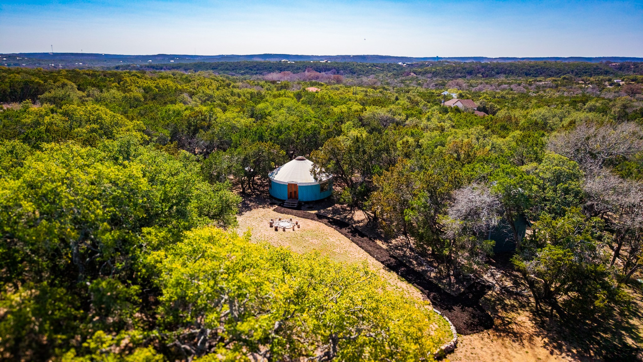 321 Lea Lane Wimberley, TX 78676 - Photo 32 of 39 Drone / aerial view of a forest