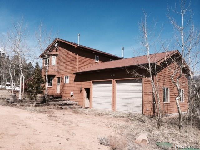 255 Timber Top Road Bailey, CO 80421 - Photo 1 of 1 a view of a house with a yard