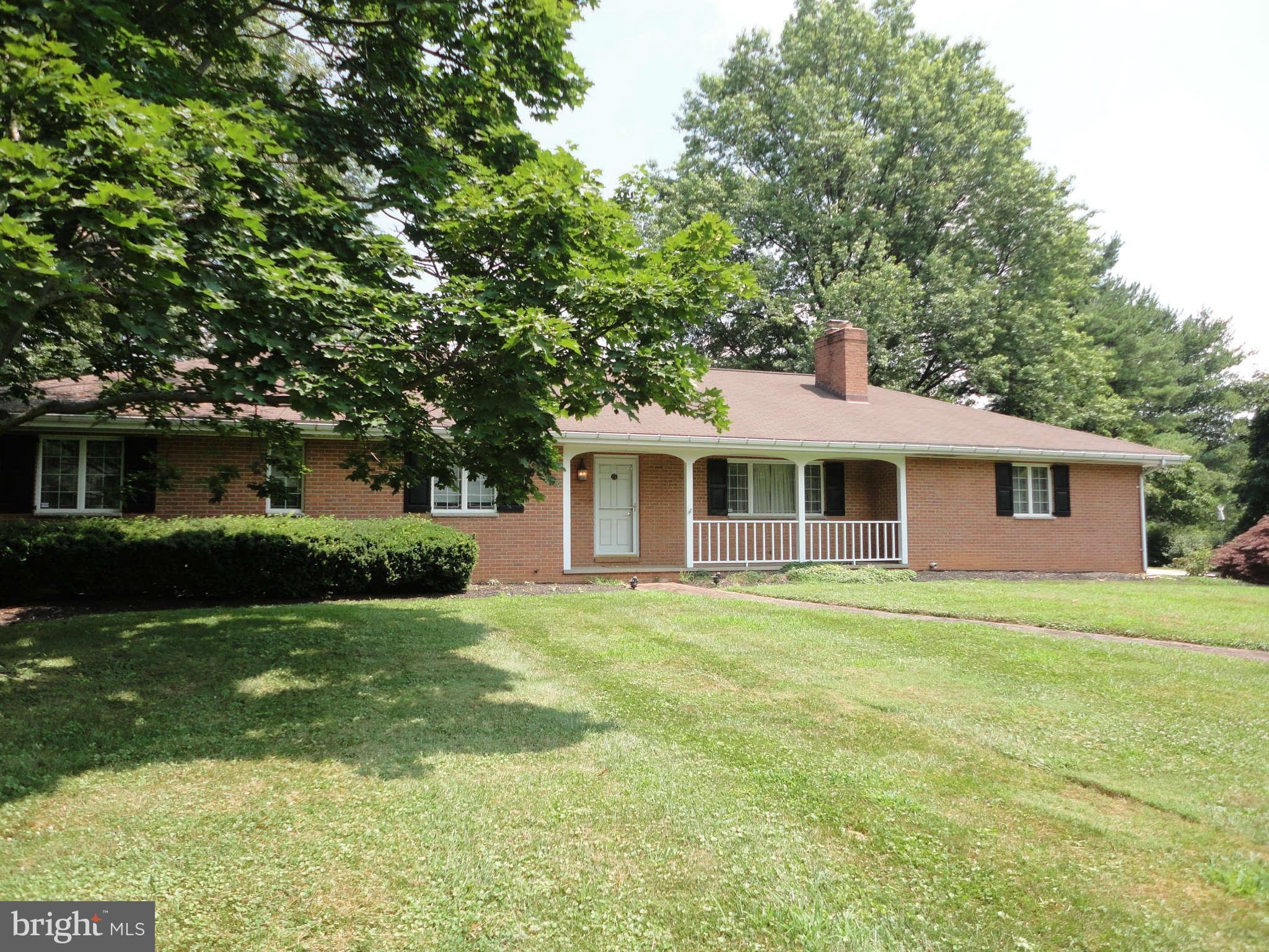 12915 Gent Road Reisterstown, MD 21136 - Photo 1 of 29 a front view of a house with a garden