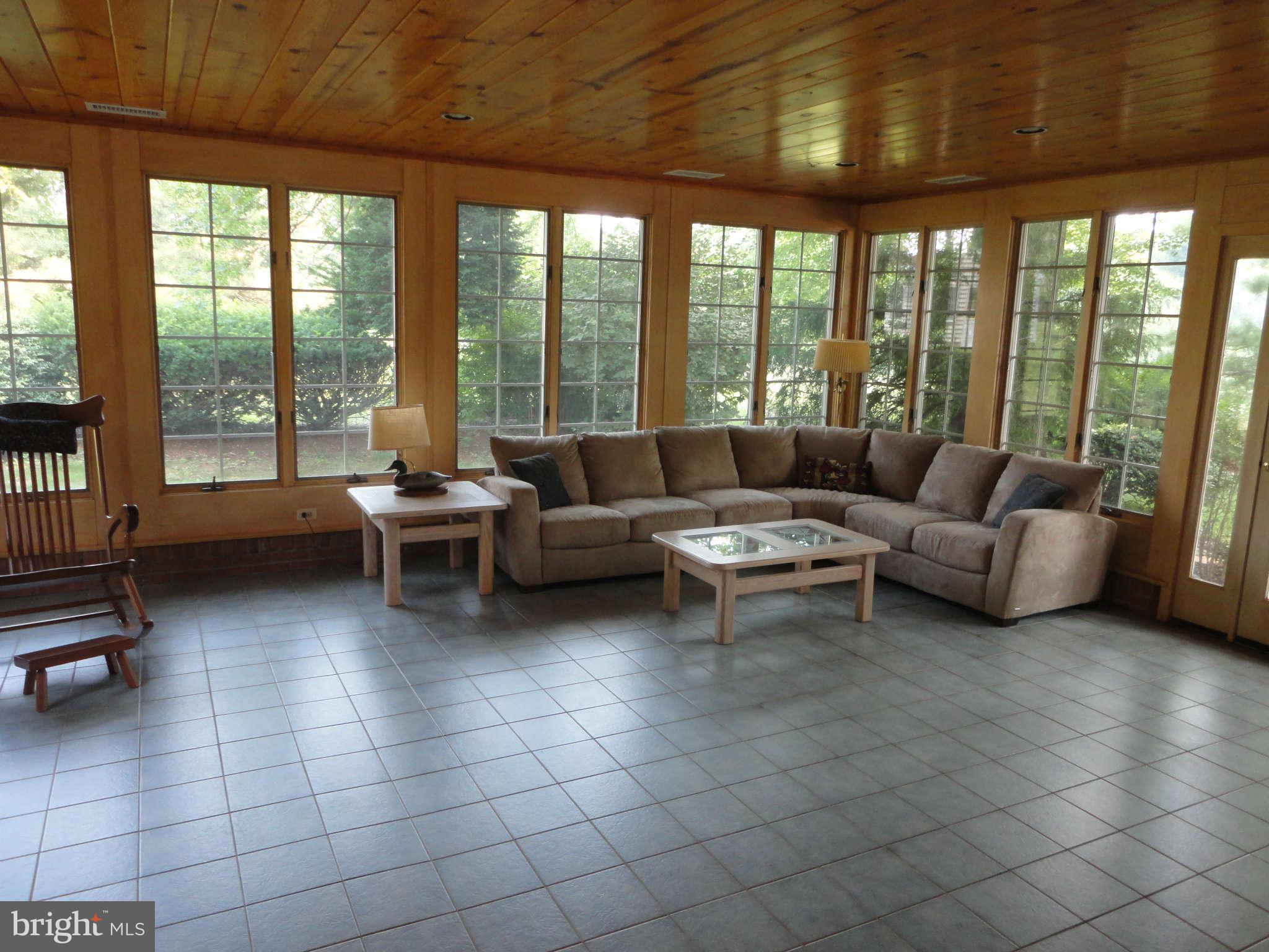 12915 Gent Road Reisterstown, MD 21136 - Photo 12 of 29 a living room with furniture and a floor to ceiling window