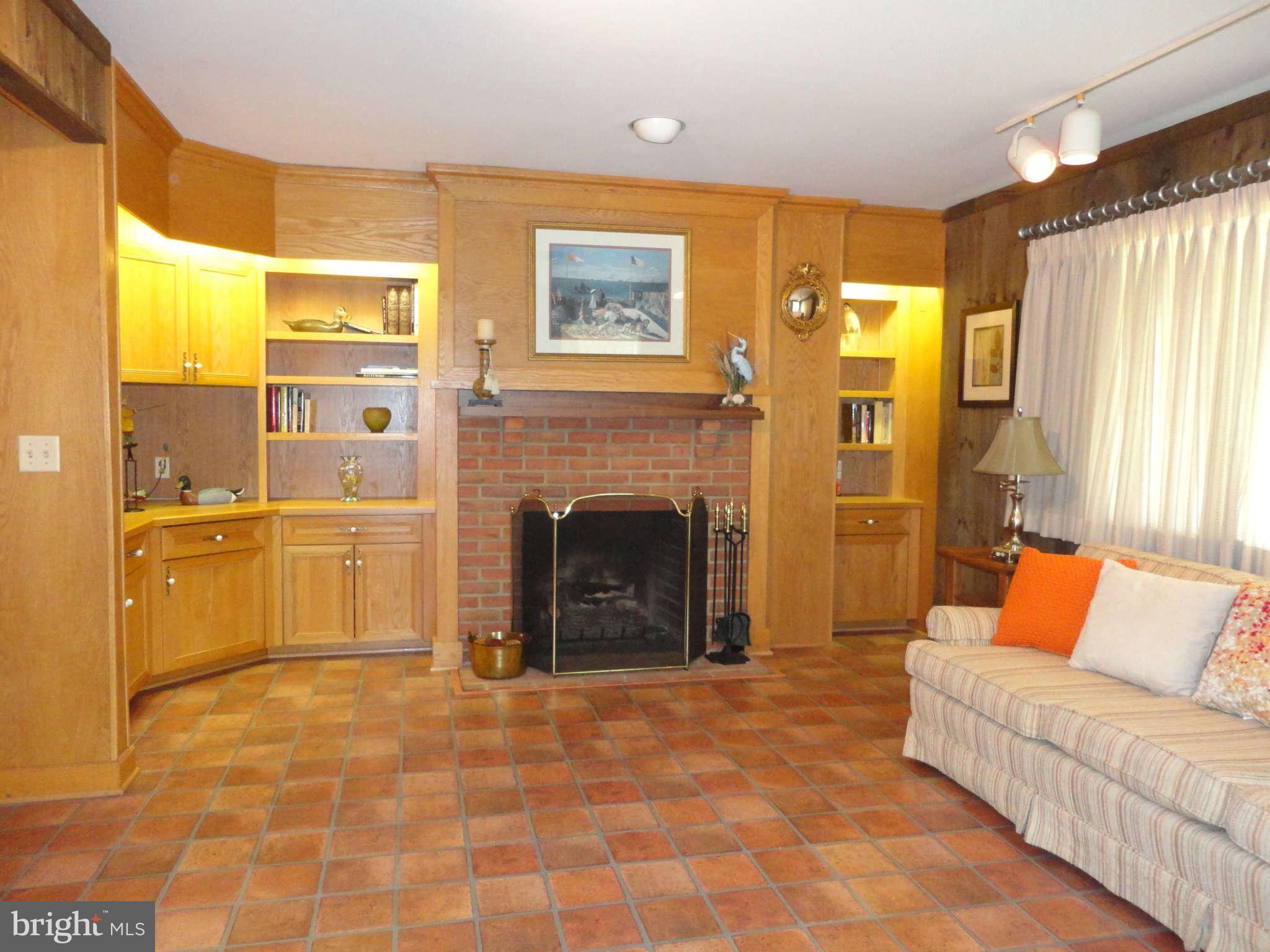 12915 Gent Road Reisterstown, MD 21136 - Photo 14 of 29 a living room with furniture a large window and a fireplace