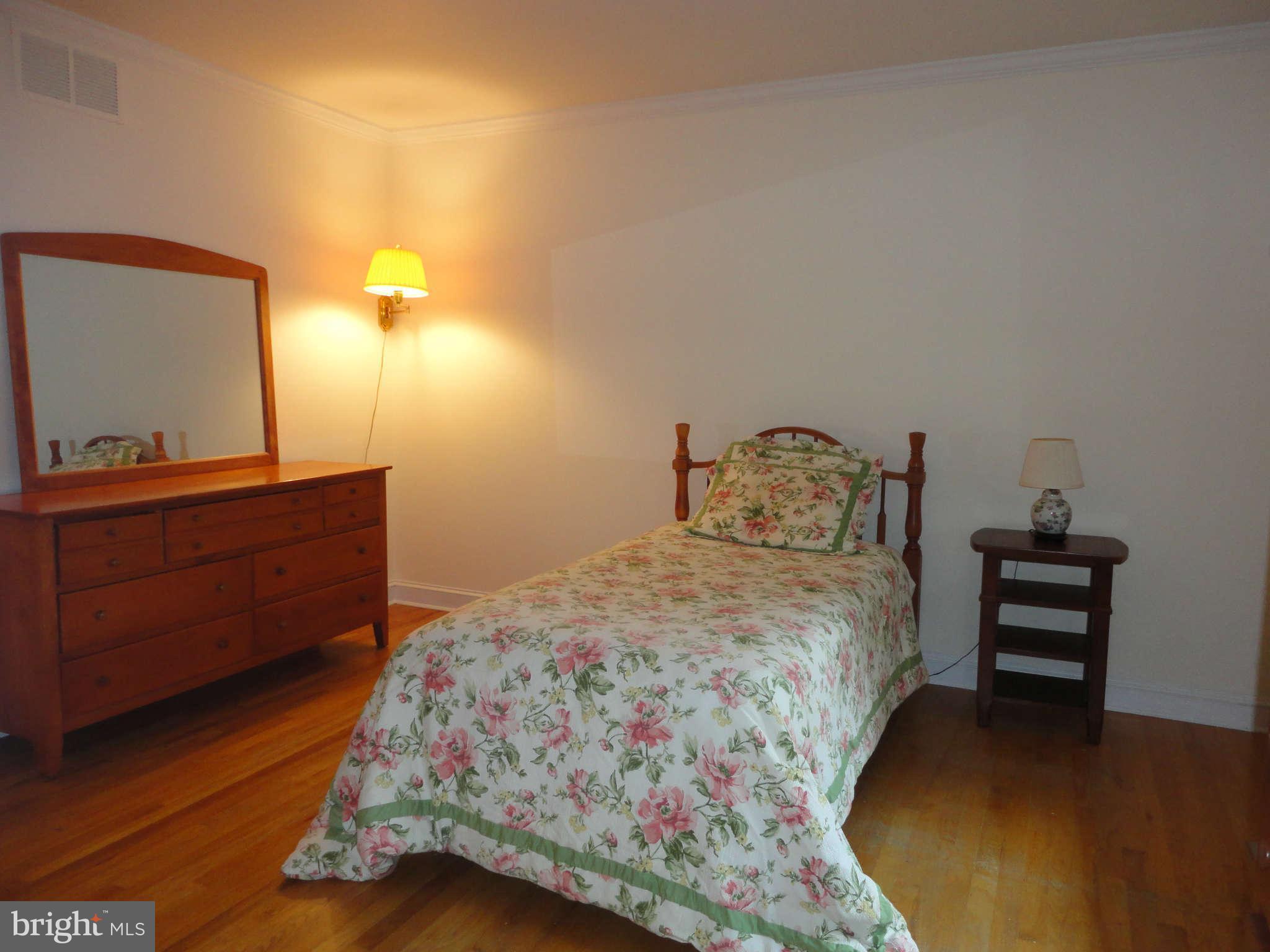 12915 Gent Road Reisterstown, MD 21136 - Photo 20 of 29 a bedroom with a bed and a dresser