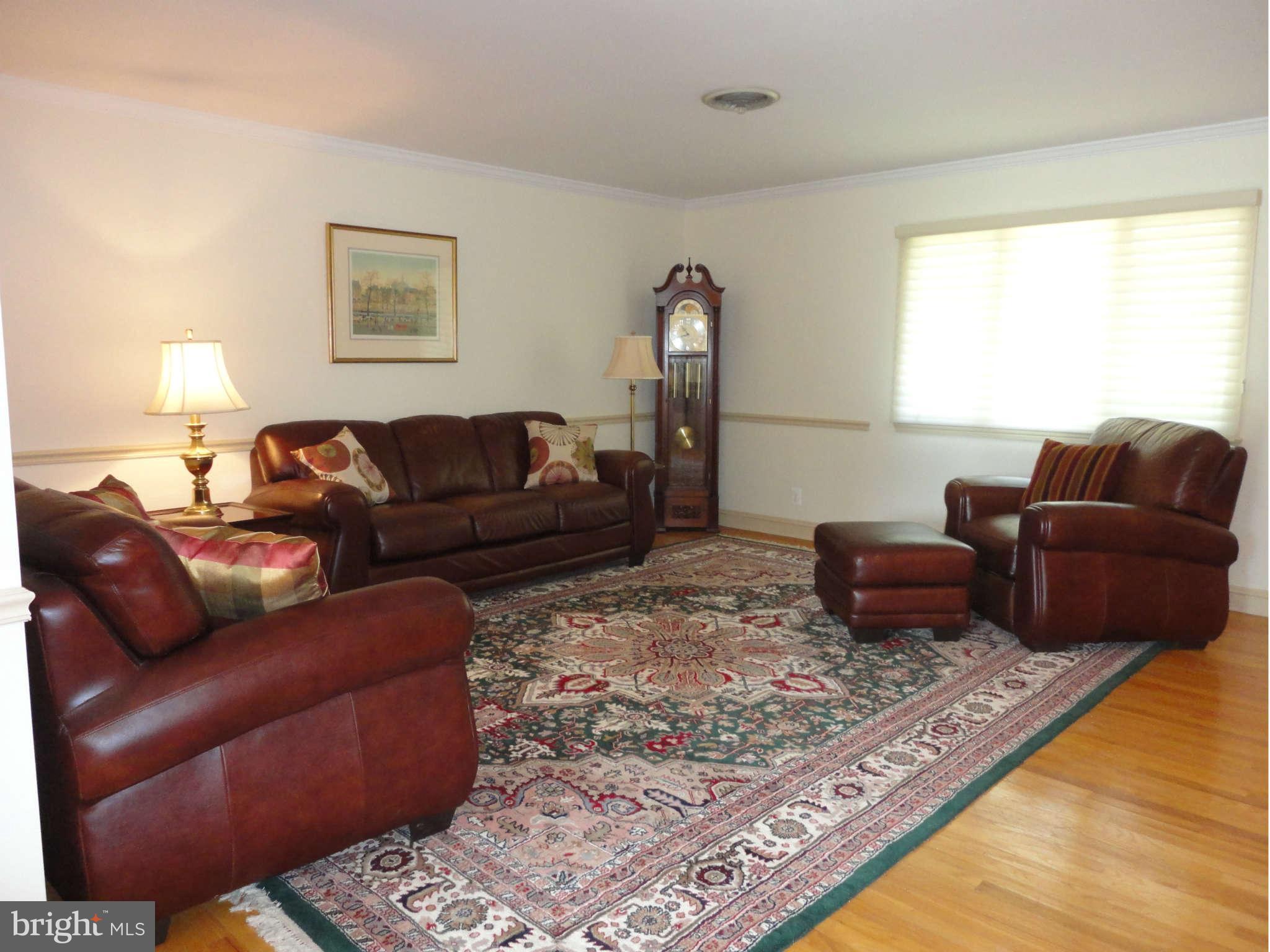 12915 Gent Road Reisterstown, MD 21136 - Photo 3 of 29 a living room with furniture and a rug