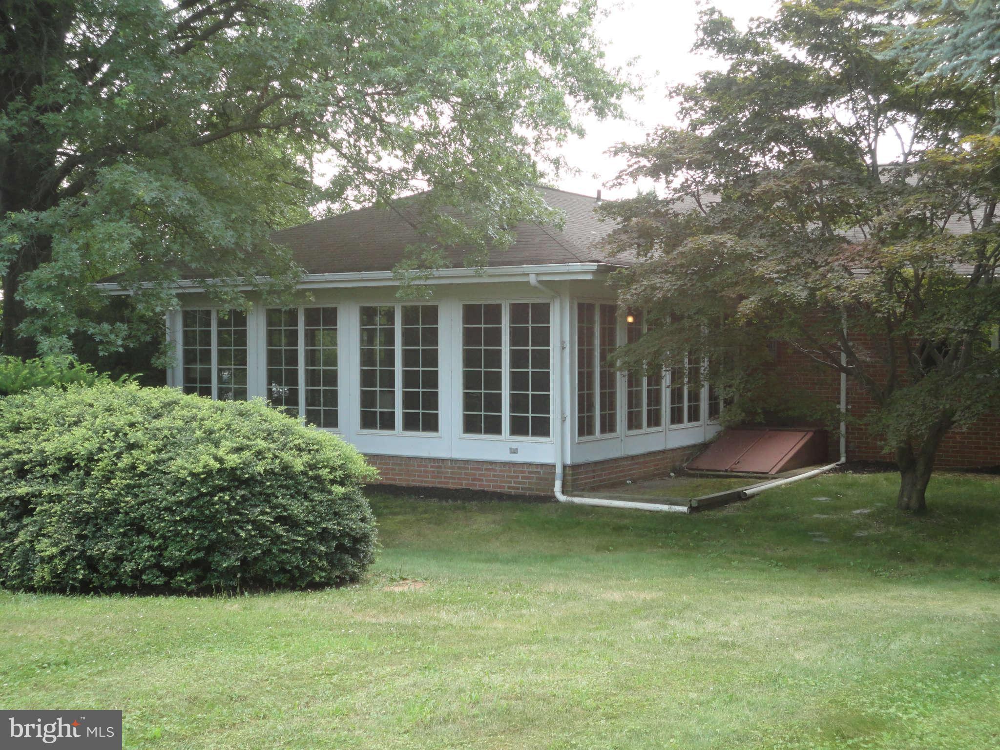 12915 Gent Road Reisterstown, MD 21136 - Photo 25 of 29 a view of a house with backyard sitting area and garden