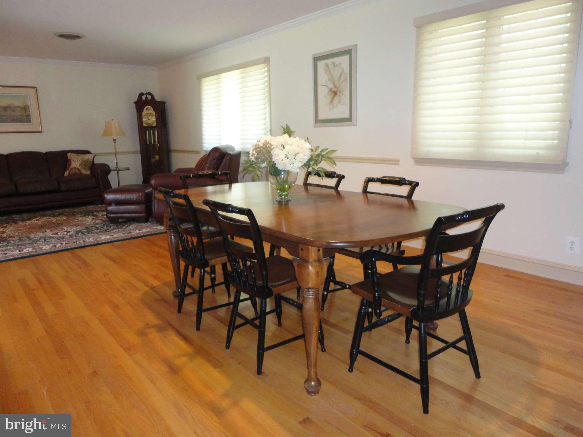 12915 Gent Road Reisterstown, MD 21136 - Photo 4 of 29 a view of a dining room with furniture and wooden floor