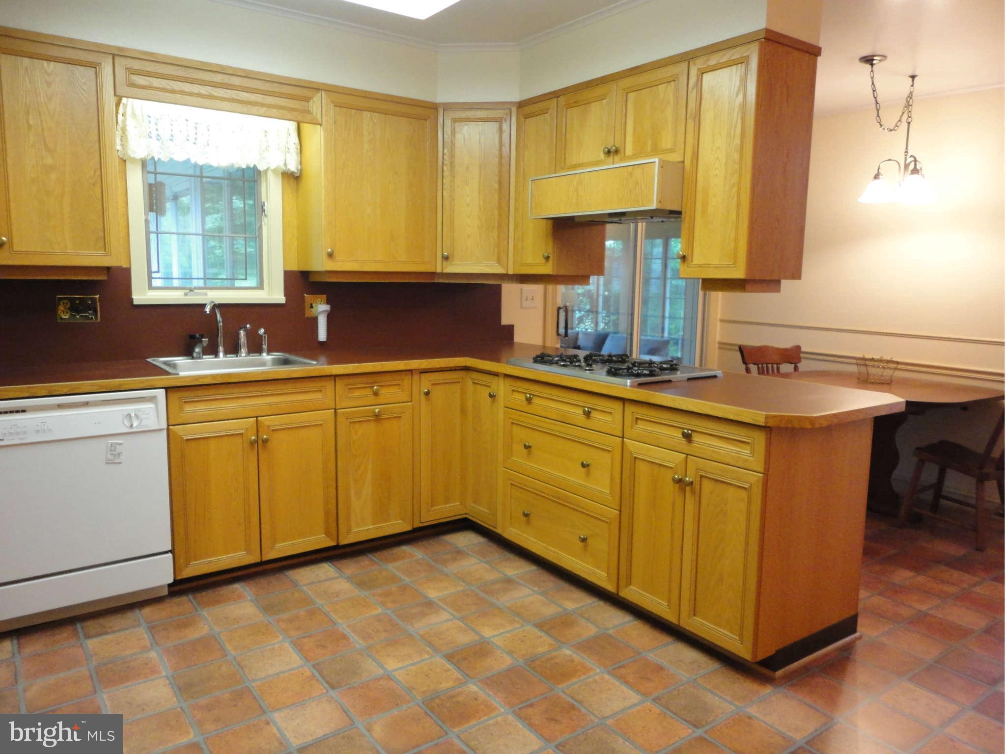 12915 Gent Road Reisterstown, MD 21136 - Photo 6 of 29 a kitchen with sink cabinets and window