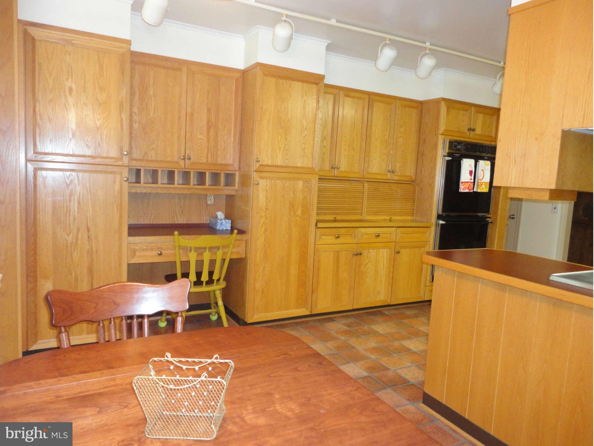 12915 Gent Road Reisterstown, MD 21136 - Photo 7 of 29 a view of a kitchen with fridge and wooden floor