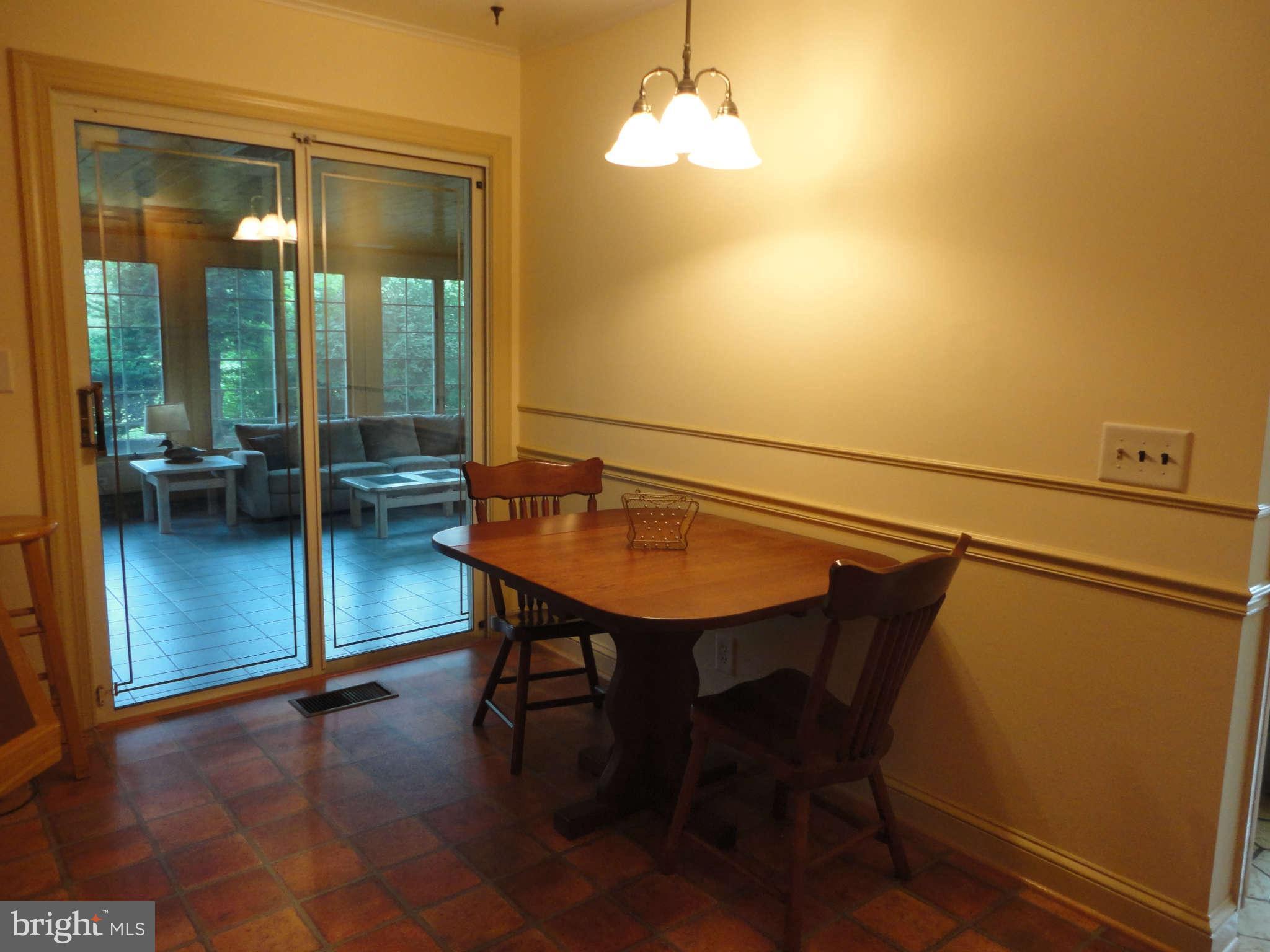 12915 Gent Road Reisterstown, MD 21136 - Photo 10 of 29 a view of a dining room with furniture and a chandelier