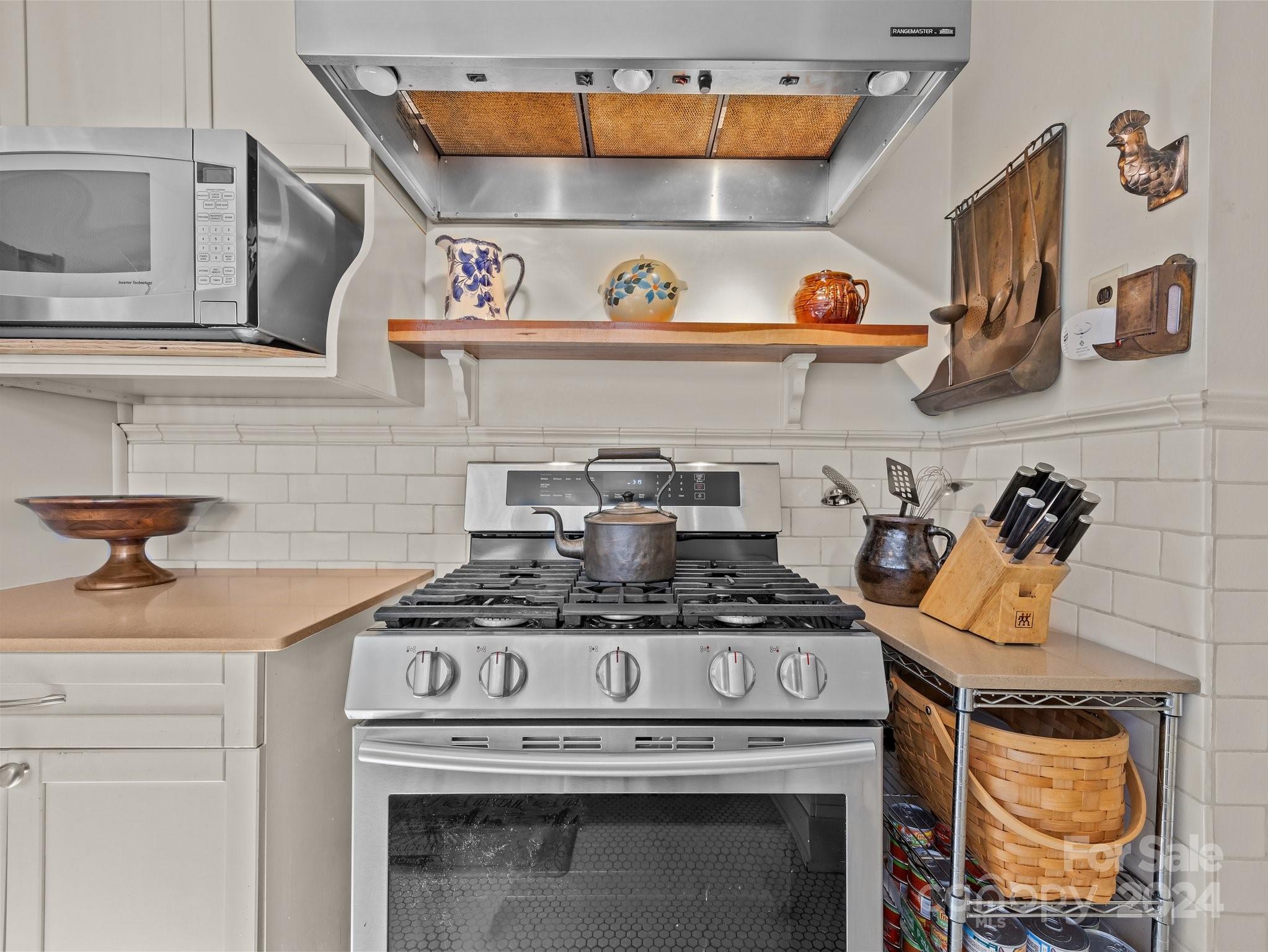 100 Edwin Place Asheville, NC 28801 - Photo 12 of 35 a stove top oven sitting inside of a kitchen