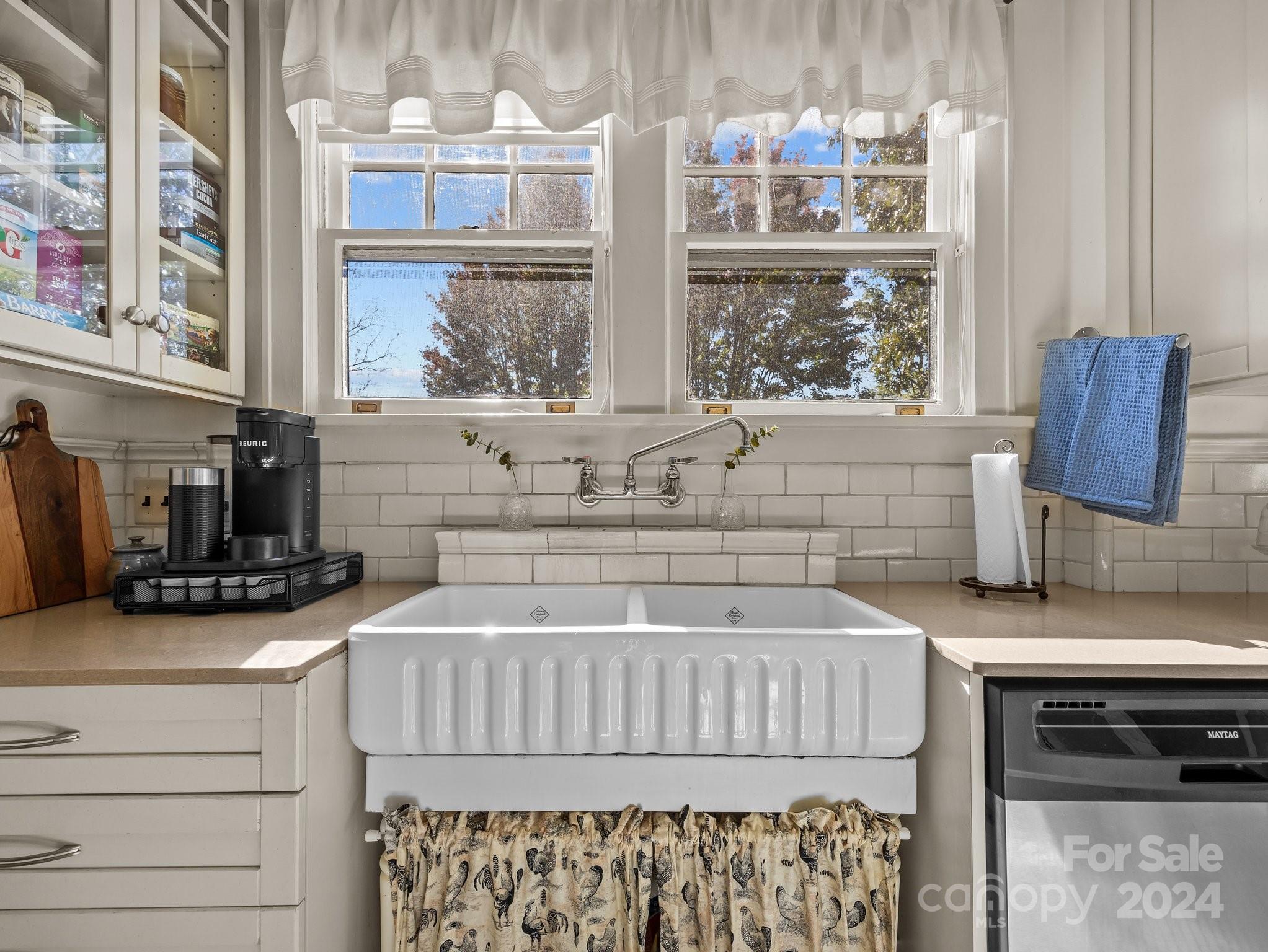 100 Edwin Place Asheville, NC 28801 - Photo 13 of 35 a kitchen with a stove a sink and a microwave