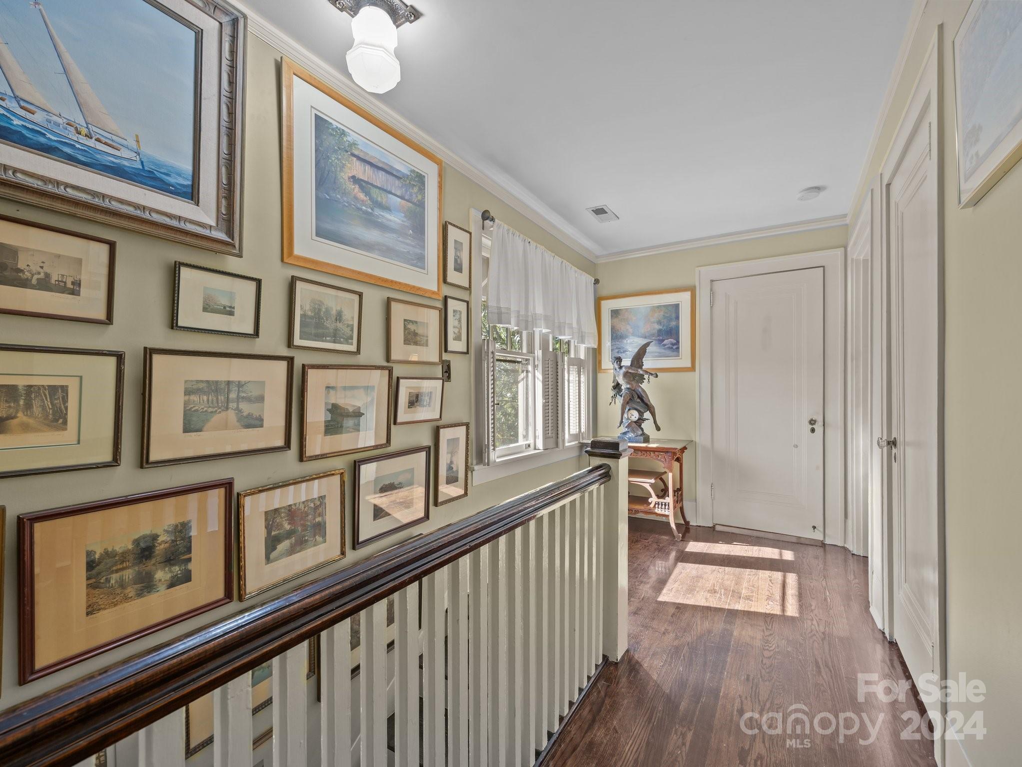100 Edwin Place Asheville, NC 28801 - Photo 16 of 35 a view of a hallway with a large window and wooden floor